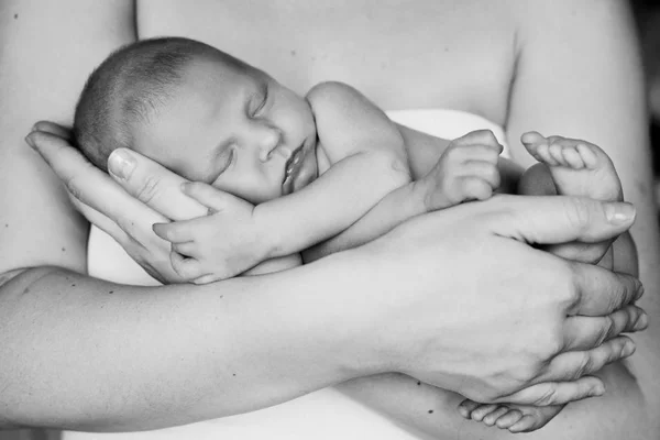 depositphotos_147408345-stock-photo-mother-holding-her-little-newborn
